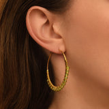 Boucles d'oreilles créoles Panarea tissées de péridot - vert pâle Peridot